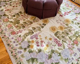 Needlepoint floral rug.  Charles Stewart tufted ottoman.