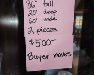 2 piece china cabinet. Bottom/base is finished on top. I would mount top to wall at ceiling height and have 2 piece, great as a bar. VERY heavy, bring help to move. $500.00