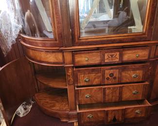 2 piece china cabinet. Bottom/base is finished on top. I would mount top to wall at ceiling height and have 2 piece, great as a bar. VERY heavy, bring help to move. $500.00