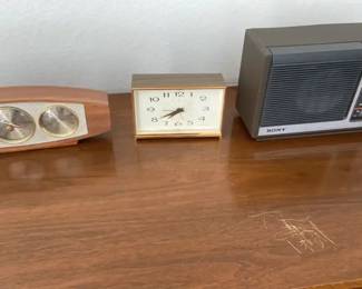 Three Vintage Collectibles Air Guide Barometer A General Electric Alarm Clock And A Sony Am Fm Radio