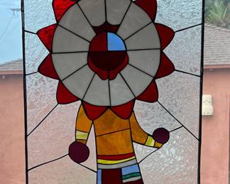 Stained glass panel featuring a Hopi Sun Katsina