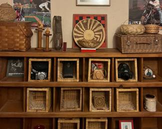 Office unit with cubby holes filled with vintage cameras etc.