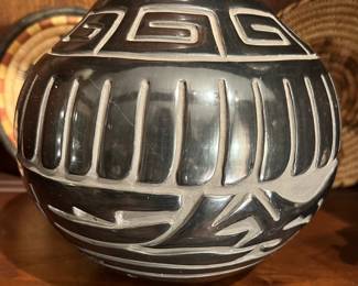 Deep carved black on black pot signed Jane and Starr from Santa Clara Pueblo 