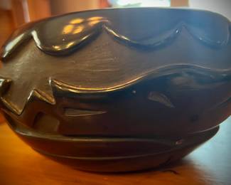 Carved Santa Clara pot signed Pablita, featuring an Avanyu (water serpent) 