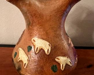 Reverse of Navajo pot featuring sheep 