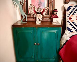 Turquoise colored cabinet and native American decor 