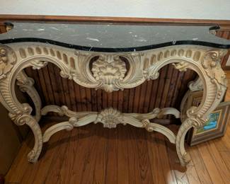 Table with a green marble top