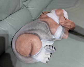 Porcelain sleeping dog