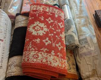 Lots of area rugs and carpets