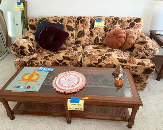 Rattan coffee table. Floral loveseat