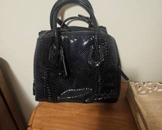 REBECCA MINKOFF
Black, patent-finished embossed snakeskin (python) pattern with dark "shellac" 