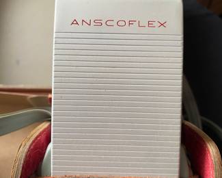 an Anscoflex II vintage box camera in its original case with the flash unit. It is a pseudo Twin Lens Reflex (TLR) camera designed by Raymond Loewy and manufactured by Ansco in the USA from around 1954-1956