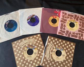 vintage 7-inch vinyl records, primarily 45 rpm singles