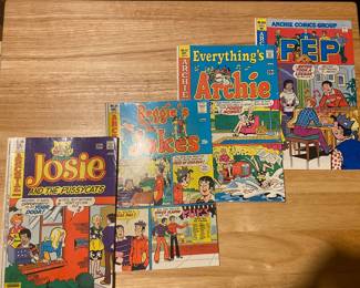 a collection of vintage Archie Comics Group comics, including issues of Everything's Archie, Reggie's Jokes, Pep Comics, and Josie and the Pussycats.