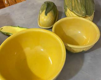 Shawnee Pottery Corn King dinnerware line, produced from 1946 to 1955. The collection includes nesting mixing bowls, a covered butter dish, and a corn-shaped side dish.