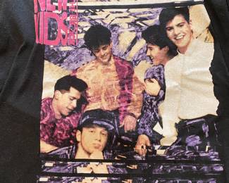 a vintage 1990s New Kids on the Block The Magic Summer Tour black t-shirt. size large 42-44