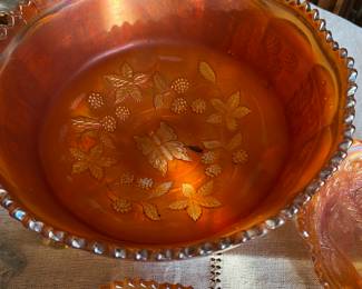 Fenton Butterfly and Berry pattern marigold carnival glass bowl, likely dating from the early 20th century.