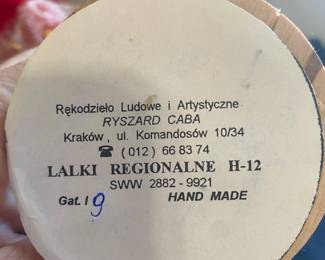 a set of handmade Polish folk art dolls, likely representing the traditional regional costumes of Krakow, Poland.