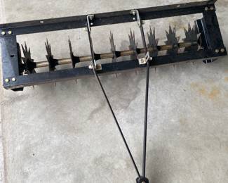 Sears tow-behind spike aerator used for lawn and garden maintenance.