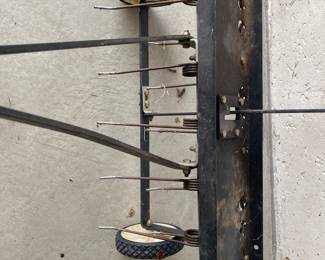 an Agri-Fab tow-behind lawn dethatcher. These dethatchers are designed to remove layers of thatch and large clippings from a lawn to promote healthier growth.