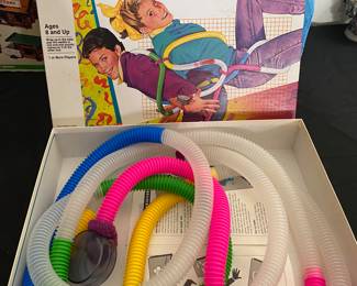 Milton Bradley Tuba-Ruba the body action game - where players connect tubes and move their bodies to get the marble from one end to the other