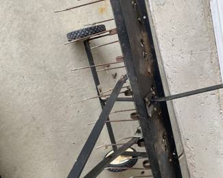 an Agri-Fab tow-behind lawn dethatcher. These dethatchers are designed to remove layers of thatch and large clippings from a lawn to promote healthier growth.