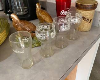 vintage Pepsi-Cola and Coca-Cola glasses,
The glasses with the white scrolled lettering are vintage Pepsi-Cola glasses from the 1970s.