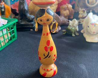 a vintage Egyptian folk art wooden spindle peg doll.