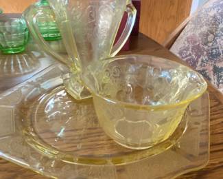 vintage amber yellow depression glass in the Madrid pattern, manufactured by the Federal Glass Company between approximately 1932 and 1939.