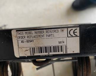 an Agri-Fab tow-behind lawn dethatcher. These dethatchers are designed to remove layers of thatch and large clippings from a lawn to promote healthier growth.