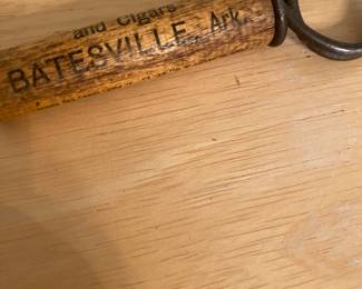vintage wood-handled pocket corkscrew with advertising for "Warren & Hardy Whiskies Wines Brandies" in Batesville, Arkansas.