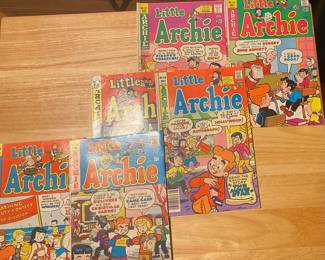vintage Little Archie comic books. They are part of the Archie Comics series and feature younger versions of the main characters.