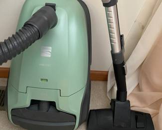 a Kenmore 400 Series Bagged Canister Vacuum in a light green color. Key features include: AllergenSeal™ System: the HEPA system captures 99.97% of dust and allergens as small as 0.3 microns.