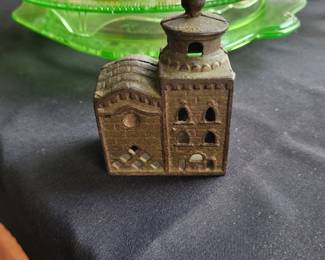 an antique cast iron still bank, commonly known as a "Domed Mosque" or "3-Story Mosque" bank.
It was manufactured by the A.C. Williams Company of Ravenna, Ohio, primarily in the 1920s.