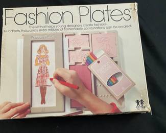 Vintage Tomy Fashion Plates design toy set - includes various interchangeable plastic plates to create different fashion designs through crayon rubbings