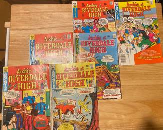 vintage Archie at Riverdale High comic books,
The comics feature characters from the Archie universe in various high school scenarios, as indicated by the titles and cover art.