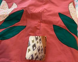 handmade unfinished quilt top featuring appliqué designs,