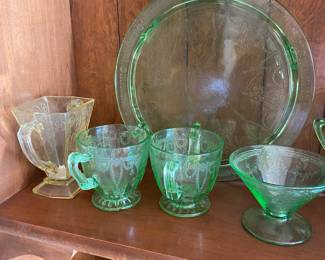 vintage Anchor Hocking Cameo Ballerina green depression glass. The pattern, also known as "Dancing Girl," features a cameo-like figure of a ballerina surrounded by floral detailing.