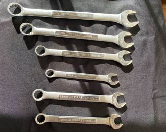 Craftsman combination wrenches sizes 1", 7/8", 3/4", 9/16", 18mm, and 19mm.