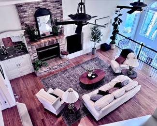 Cream Leather Sofa, Two Reclining Chairs, Area Rug, Two Brass Stiffel Lamps, Coffee Table, End Tables and Décor