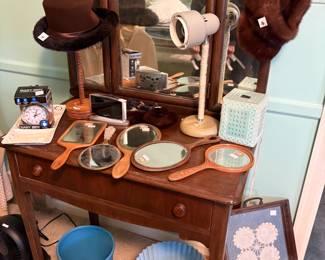 . . . a nice collection of vintage hand mirrors and a child's vanity