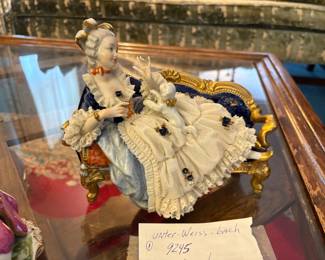 . . . another turn-of-the-century figure -- lady on couch