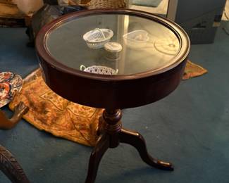 . . . glass-topped curio table