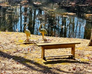 Metal garden crane sculptures & wood bench 