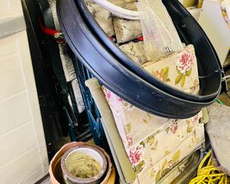 Padded outdoor chairs, flower pots, garden edging, extension cord, plastic storage cabinet