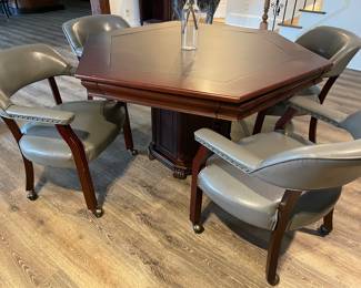 Game table with 6 chairs (2 not pictured). Table tops flips over to green felt