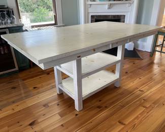 $300; Modern farmhouse-style wood table/island; approx. 36" x 72" (including 12" leaf) x 42". Minor wear from use.