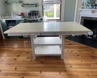 $300; Modern farmhouse-style wood table/island; approx. 36" x 72" (including 12" leaf) x 42". Minor wear from use.