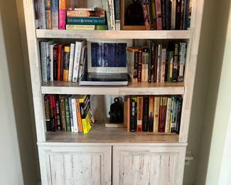 $100; Modern 3-shelf bookcase w/cabinet doors; composite/laminate; approx. 70" x 35" x 12"