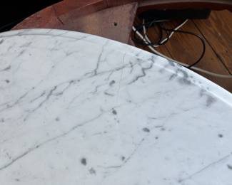 $60; Vintage Victorian-style low marble top table; approx. 17.5" x 33.5" x 22"; wear to base, crack to part of marble